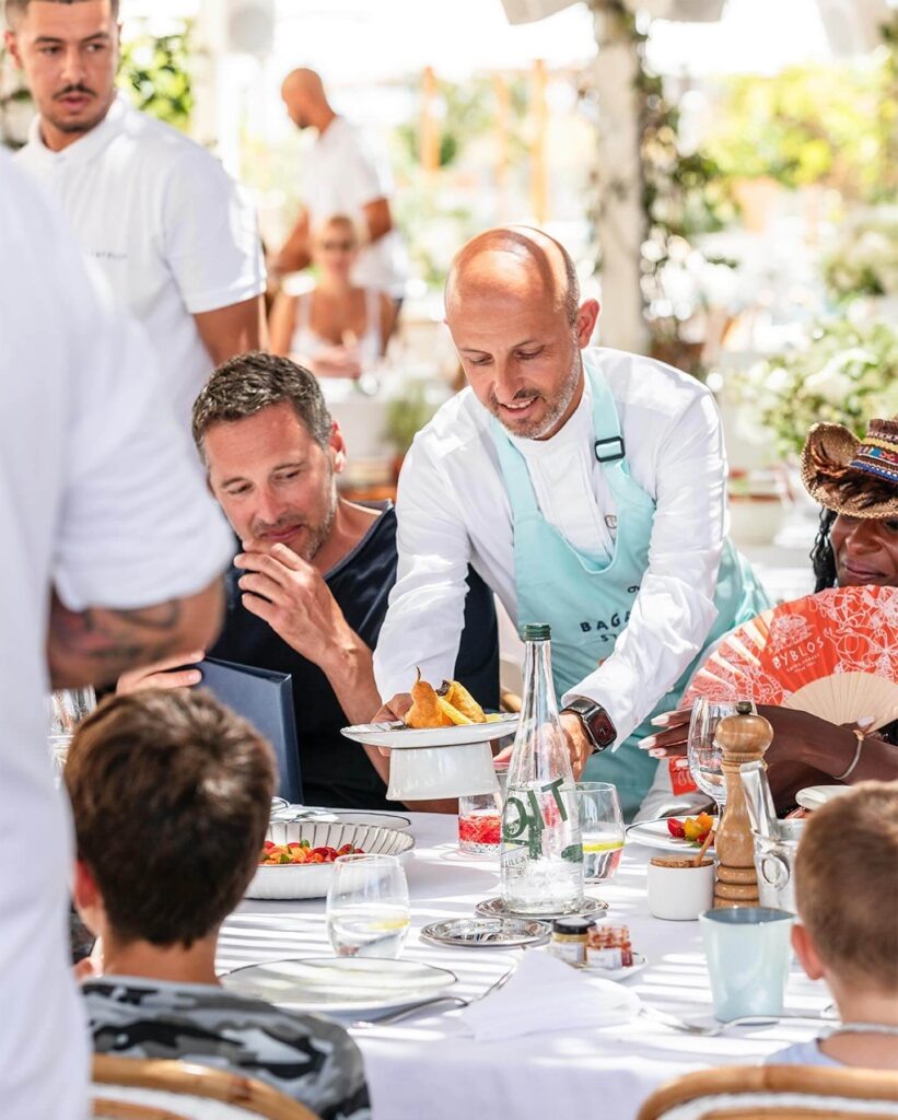 Champagne celebration with sparklers at Bagatelle Saint-Tropez restaurant