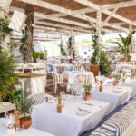 Lively lunch ambiance with guests dining at Bagatelle Saint-Tropez