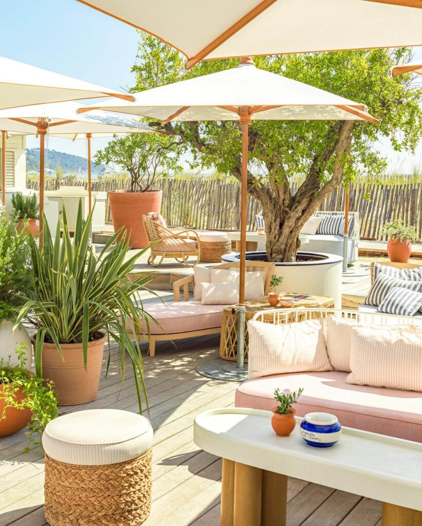 Terrace framed by olive trees and floral decor at Bagatelle Saint-Tropez