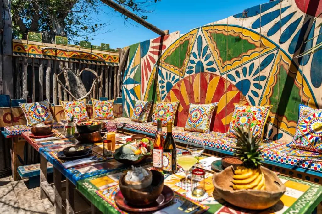 Outdoor dining setup featuring the Dolce & Gabbana signature DG Carretto motif