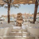 Elegant beachfront terrace with luxury seating overlooking the marina at La Opera Saint-Tropez