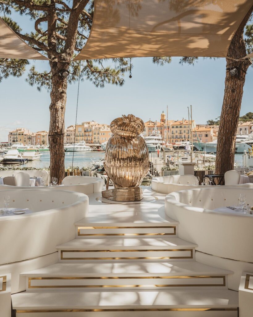 Elegant beachfront terrace with luxury seating overlooking the marina at La Opera Saint-Tropez