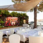 Outdoor dining terrace with champagne display at La Opera Saint-Tropez