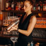 Bartender preparing a signature cocktail at Le Café Saint-Tropez