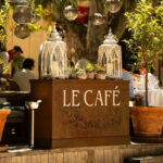 Friends celebrating at Le Café Saint-Tropez