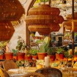 Garden terrace with outdoor dining at Le Café Saint-Tropez