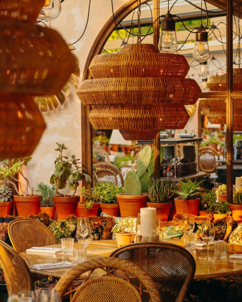 Garden terrace with outdoor dining at Le Café Saint-Tropez