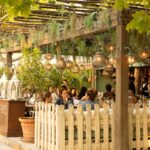 Outdoor patio with elegant seating at Le Café Saint-Tropez