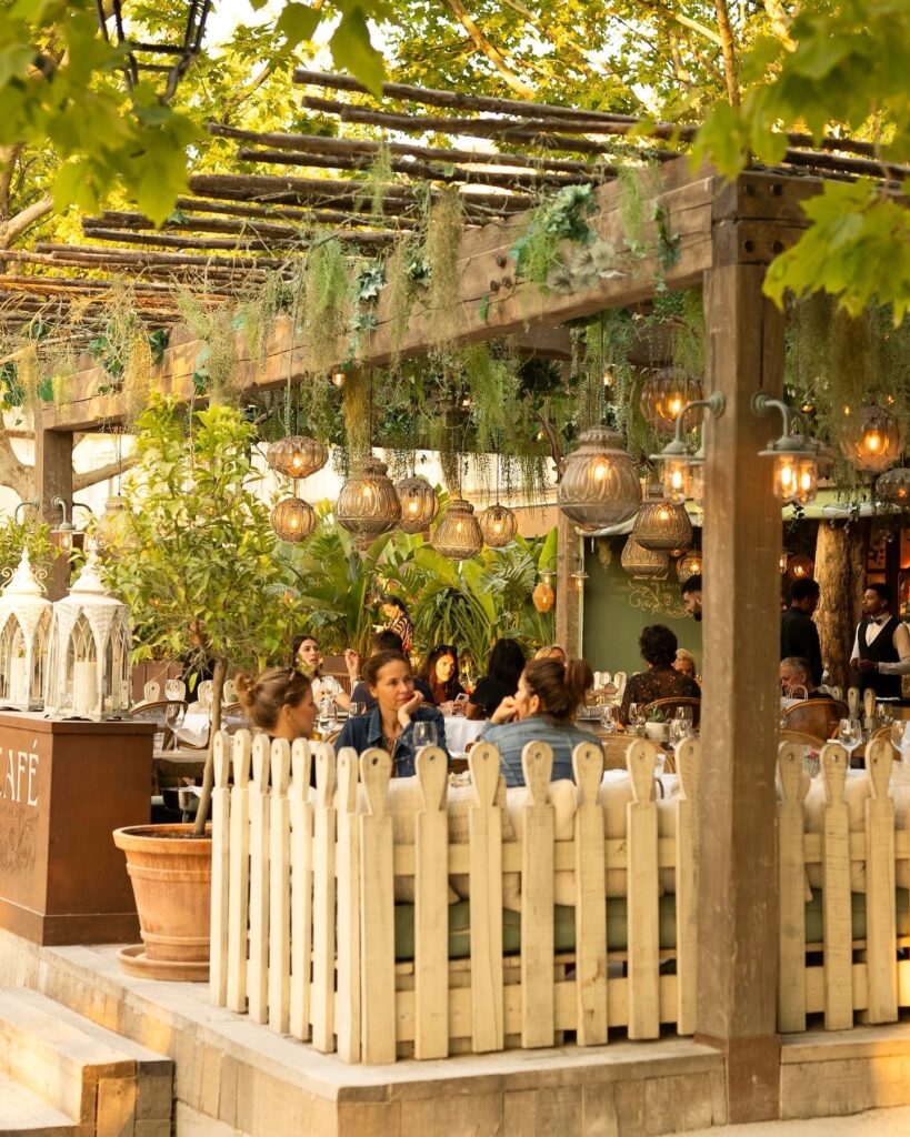 Outdoor patio with elegant seating at Le Café Saint-Tropez