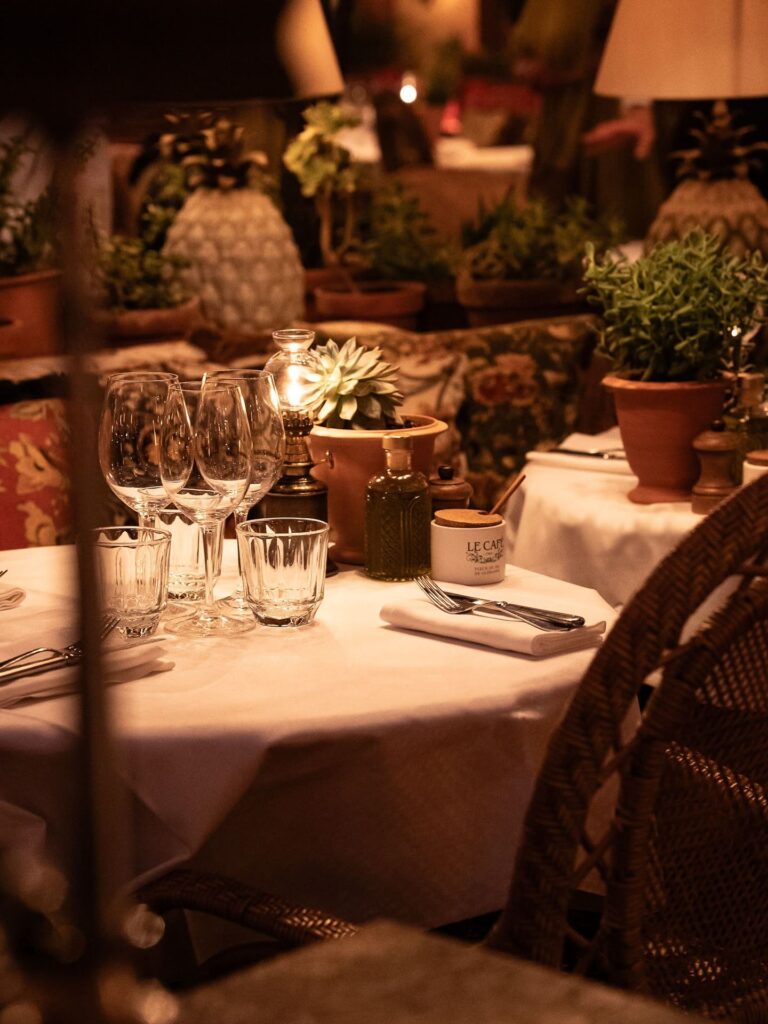 Elegant table setting prepared for guests at Le Café Saint-Tropez