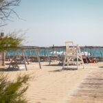 Le Club 55 beach with sun loungers and lifeguard chair on Pampelonne Beach, Saint-Tropez