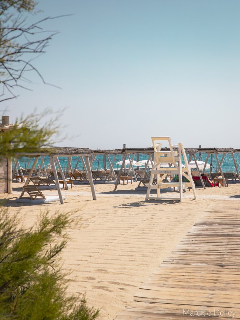 Le Club 55 beach with sun loungers and lifeguard chair on Pampelonne Beach, Saint-Tropez