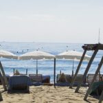 Sun loungers and parasols facing the sea at Le Club 55, Pampelonne Beach, Saint-Tropez