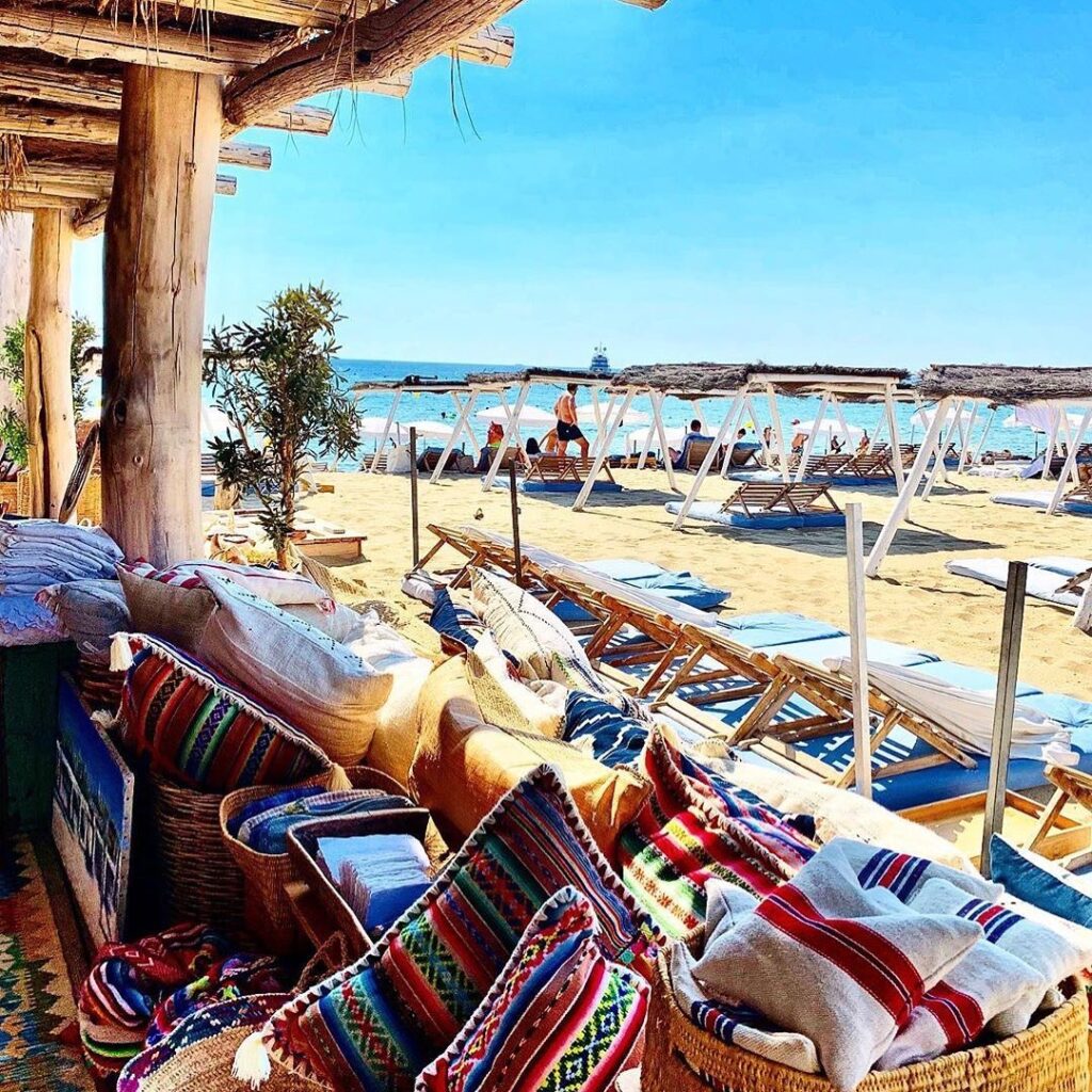 Colourful cushions, woven baskets and textiles at the Le Club 55 beach boutique, Saint-Tropez