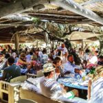 Guests enjoying a busy lunch service at the Le Club 55 restaurant, Saint-Tropez
