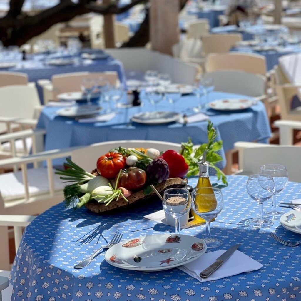 Fresh vegetable platter and table setting at the Le Club 55 restaurant, Saint-Tropez