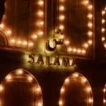 Illuminated Salama restaurant sign in Saint-Tropez