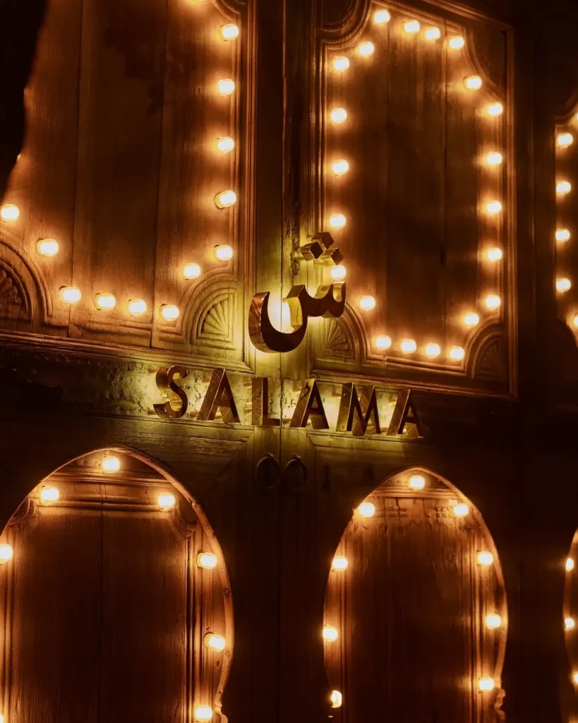 Illuminated Salama restaurant sign in Saint-Tropez