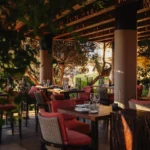 Guests enjoying sunset dining on the terrace at Zuma Porto Cervo