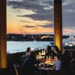 Outdoor restaurant seating surrounded by greenery at Zuma Porto Cervo