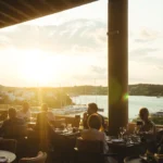 Outdoor dining table with marina views at Zuma Porto Cervo