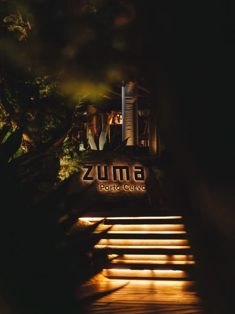 Guests dining at Zuma Porto Cervo overlooking the marina