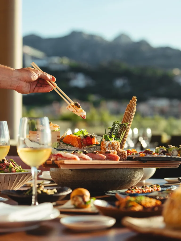 Seafood dishes served on an outdoor table at Zuma Porto Cervo
