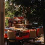 Guests enjoying sunset dining on the terrace at Zuma Porto Cervo