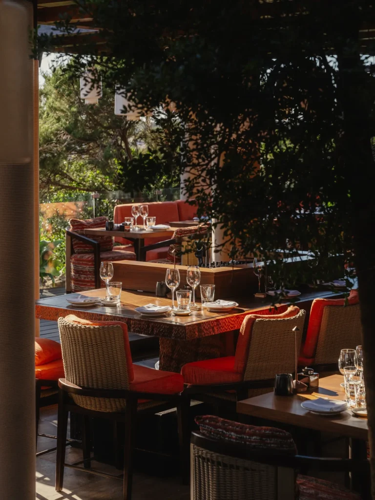 Guests enjoying sunset dining on the terrace at Zuma Porto Cervo