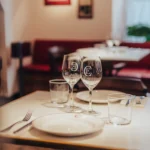 Marble table set with monogrammed glassware and plates at El Caminito Palma