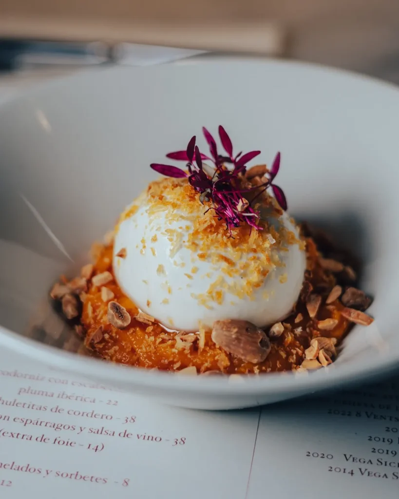 Poached egg over squash purée topped with toasted almonds and microgreens at El Camino Restaurant