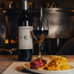 Steak tartare with fries and a glass of house El Camino red wine at El Camino Restaurant