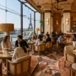 Guests dining beside floor-to-ceiling windows framing the Eiffel Tower at Gigi Rigolatto Paris