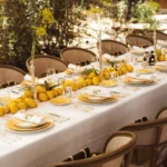 Long table dressed with lemons, silver and yellow flowers in the garden at Gigi Rigolatto Saint-Tropez