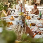 Guests lunching along a table laid with oranges and lemons at Gigi Rigolatto Saint-Tropez