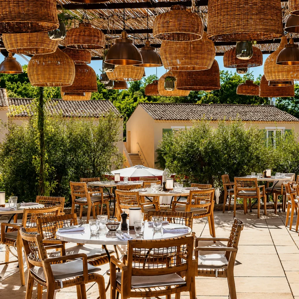 Outdoor restaurant seating at Hôtel Lou Pinet Saint-Tropez
