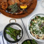 Breaded veal chop with charred lemon, broccolini and a kale salad at Interni Restaurant Mykonos