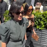 Guests leaving past the hedged terrace on a sunny day at lavenue Paris