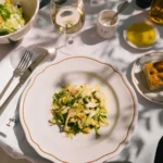 Shaved artichoke and rocket salad with white wine and focaccia at Loulou Restaurant Saint-Tropez