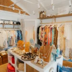 Boutique interior with racks of beachwear, hats and jewellery displays at Nikki Beach Saint Barth