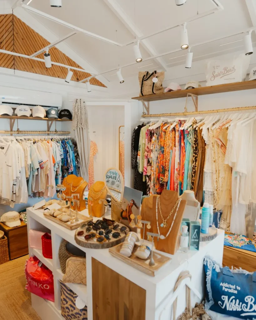 Boutique interior with racks of beachwear, hats and jewellery displays at Nikki Beach Saint Barth