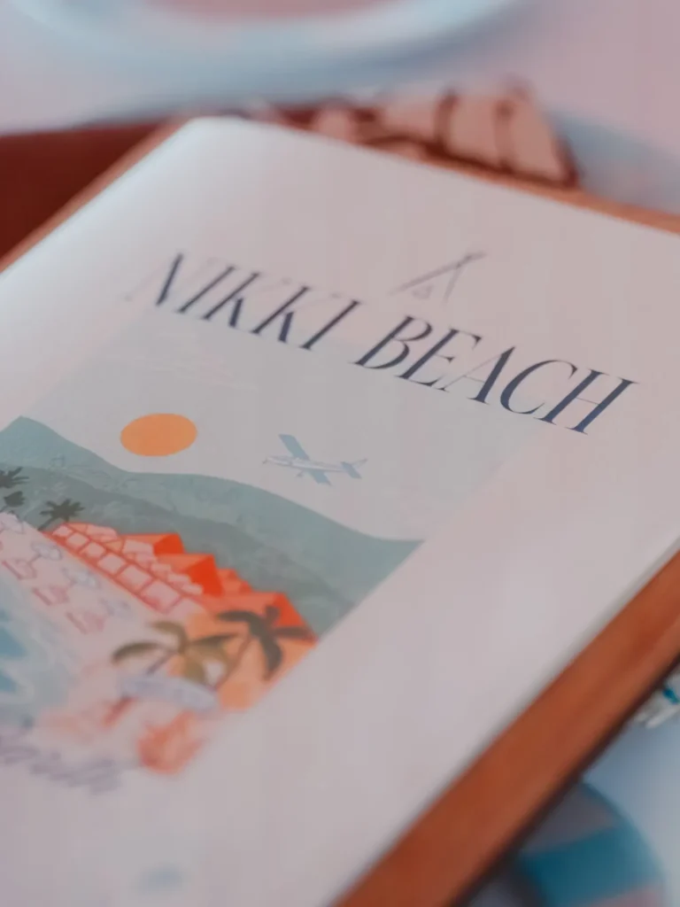 Illustrated Nikki Beach menu resting on a table at Nikki Beach Saint Barth