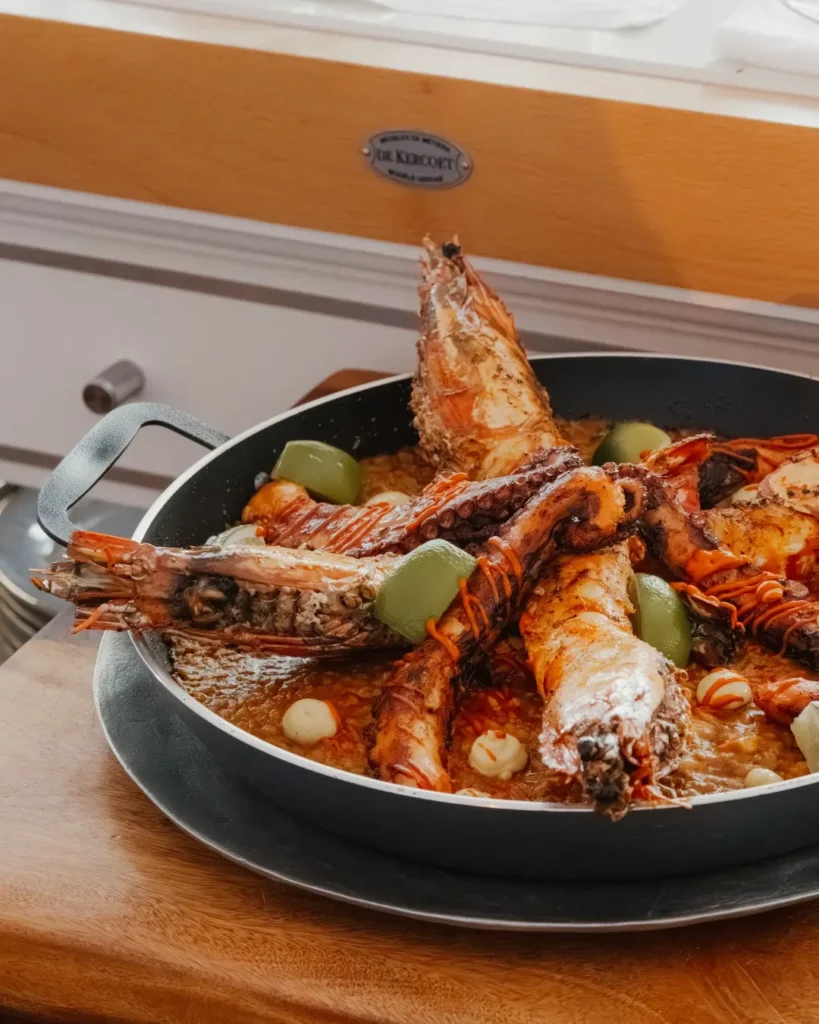 Seafood paella with prawns and octopus in a pan at Nikki Beach Saint Barth