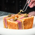 Seared tuna katsu sando finished with caviar and gold leaf at Nikki Beach Saint Barth