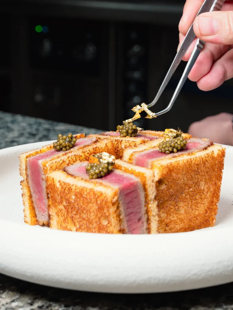 Seared tuna katsu sando finished with caviar and gold leaf at Nikki Beach Saint Barth
