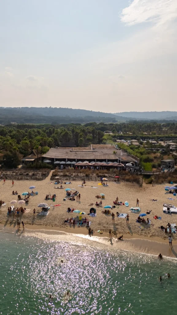 Aerial view of the beach club and busy shoreline at Shellona Saint-Tropez