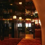 Sophisticated bar interior with warm lighting at Siena Paris