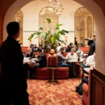 Guests dining in the elegant interior of Siena Paris restaurant