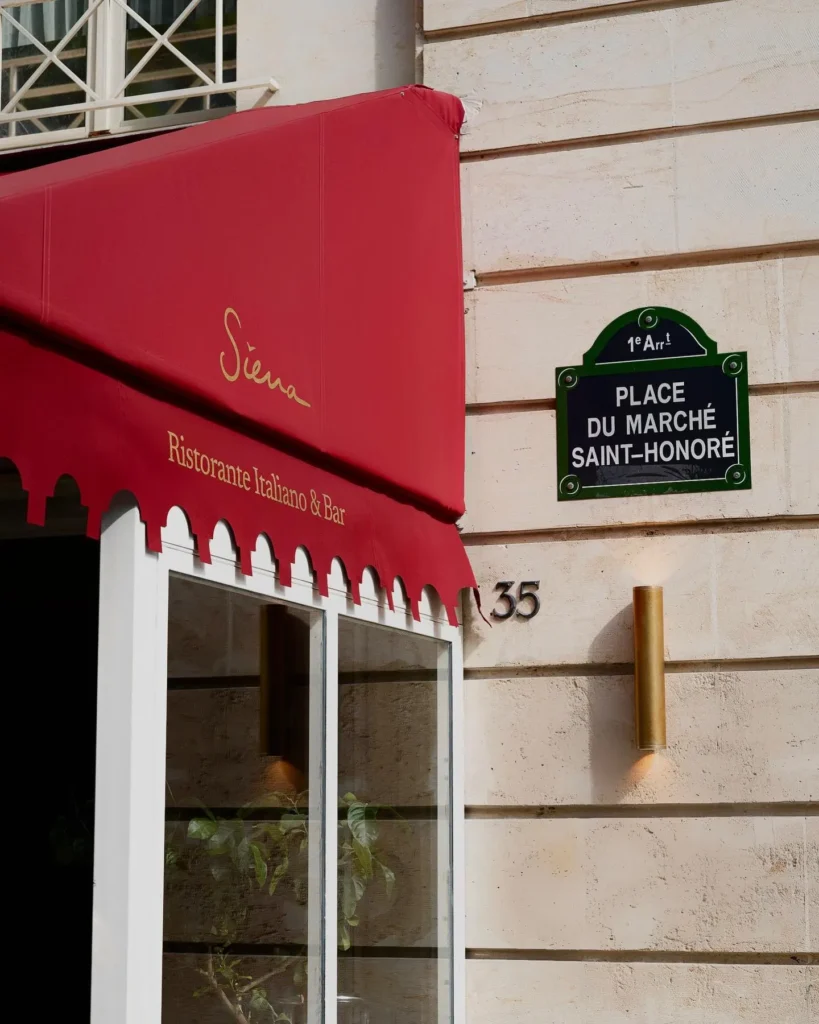 Exterior facade and red awning of Siena Paris restaurant