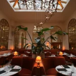 Elegant main dining room with arched windows at Siena Paris